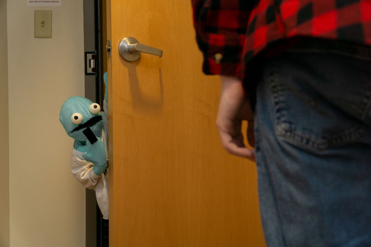 Chet leaves flipping off his roomate as he steps out the door.