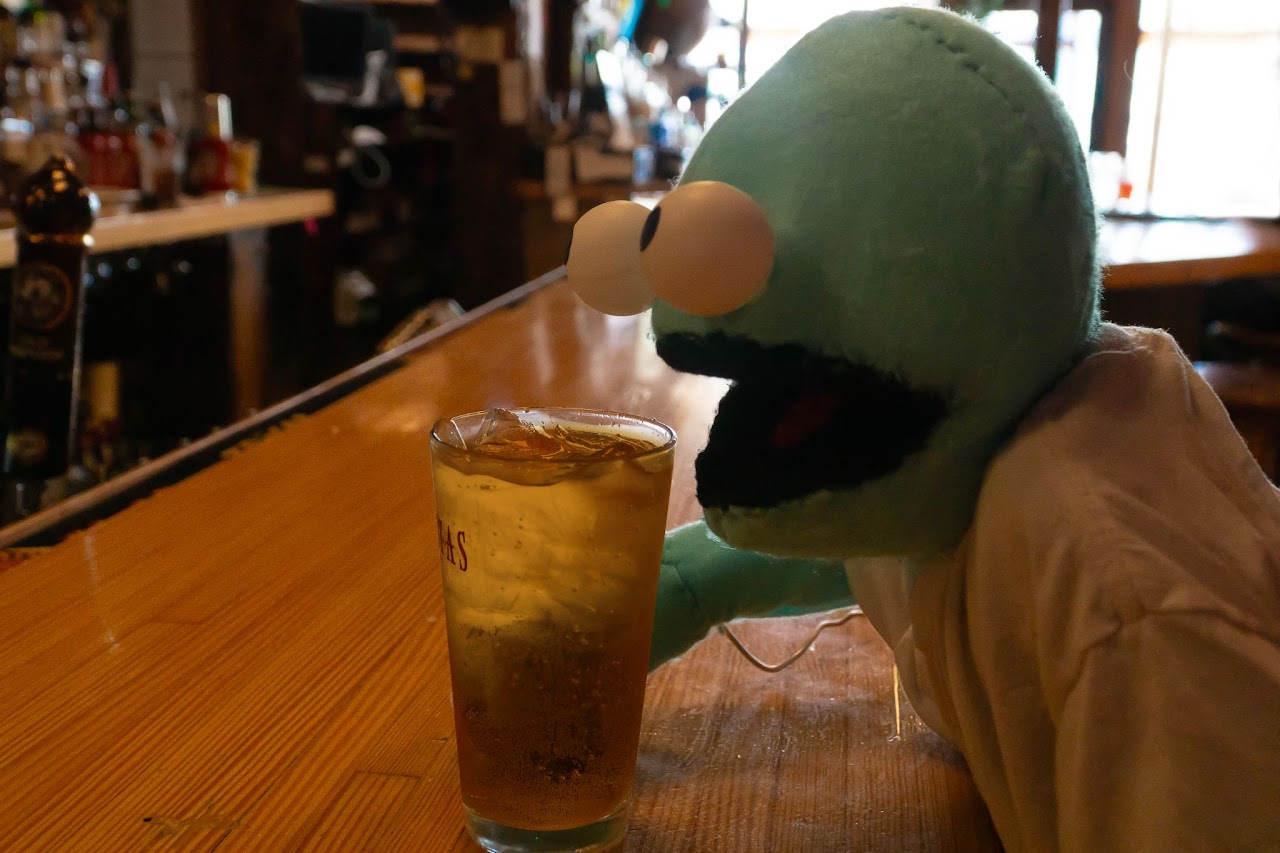 Chet is solumly drinking alone.